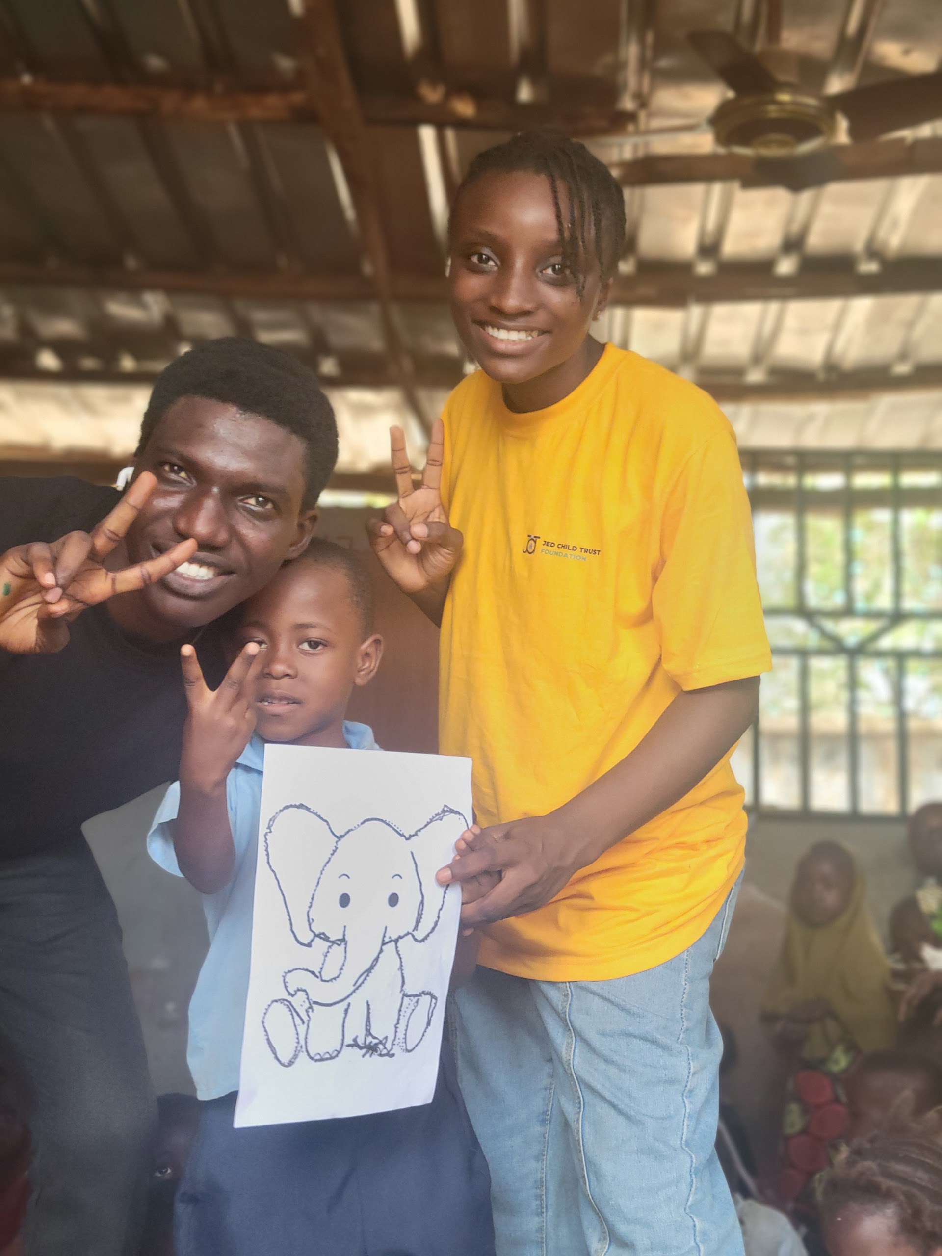 Jed Child Trust volunteers with a child at IDP Outreach