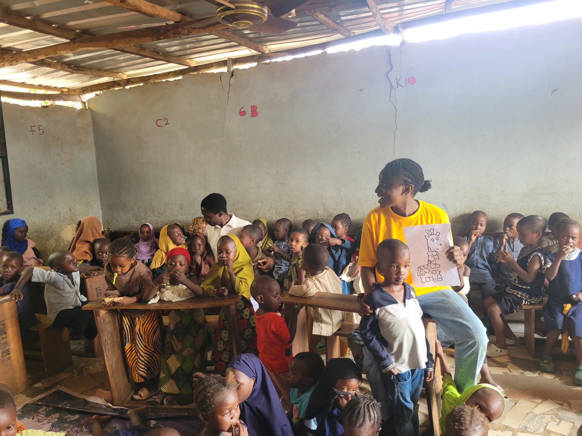 Volunteer teaching a class at IDP Outreach